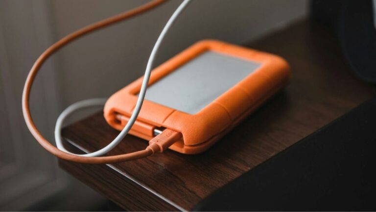 Charging cables on a side table, a cue to park tech away from the bed for calmer evenings.
