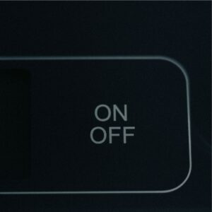 Close-up of ON and OFF labels on a device panel, a gentle cue to set calm screen boundaries.