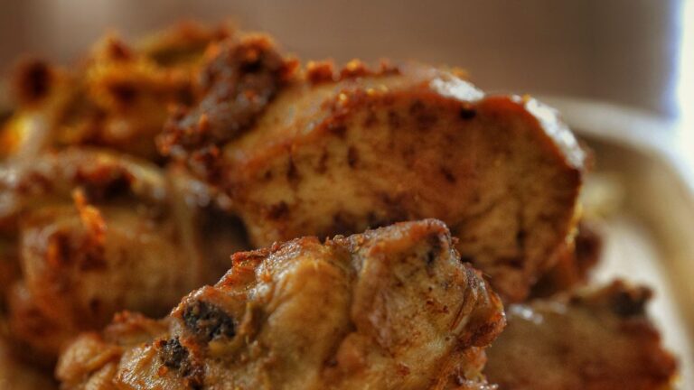 Close-up of browned chicken bites resting to drain after cooking