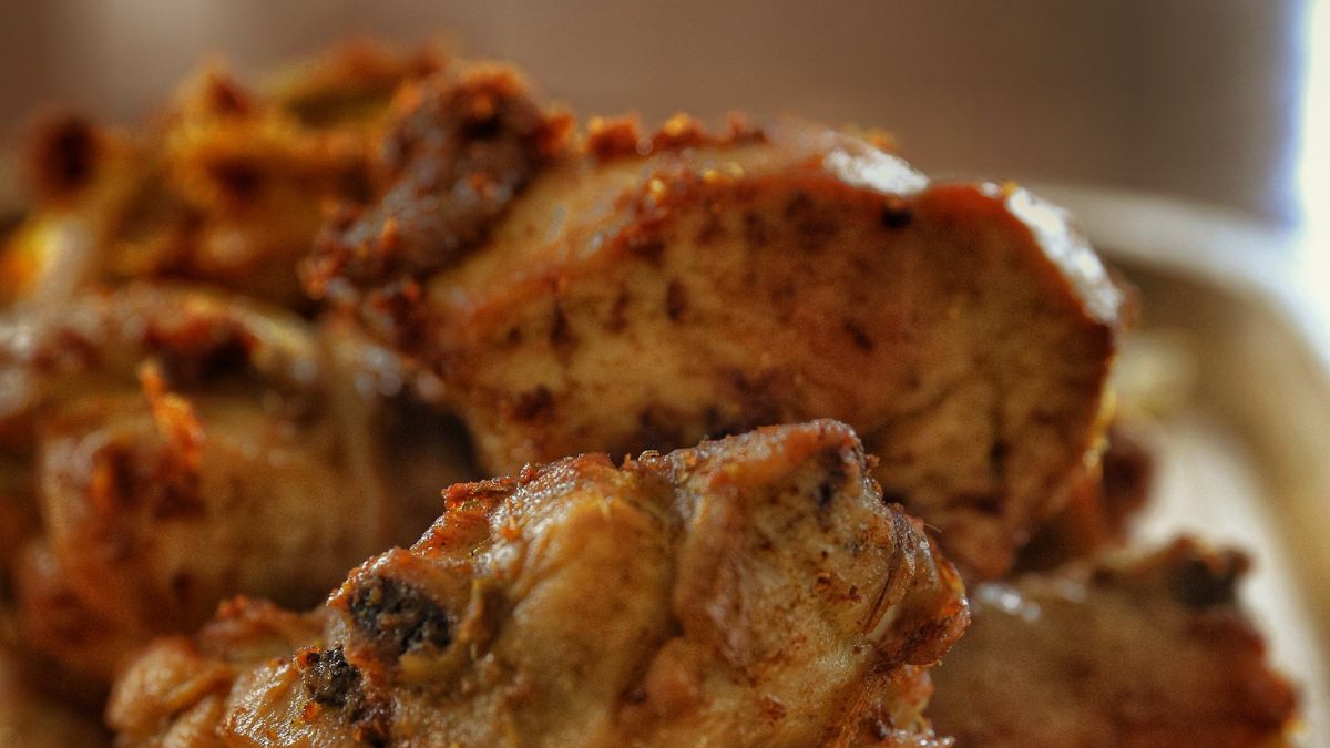 Close-up of browned chicken bites resting to drain after cooking
