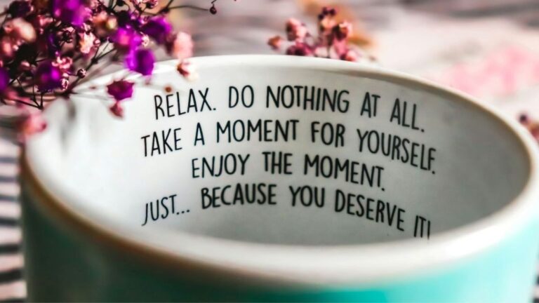 Close-up of a mug with a calming message about rest and taking a moment for yourself