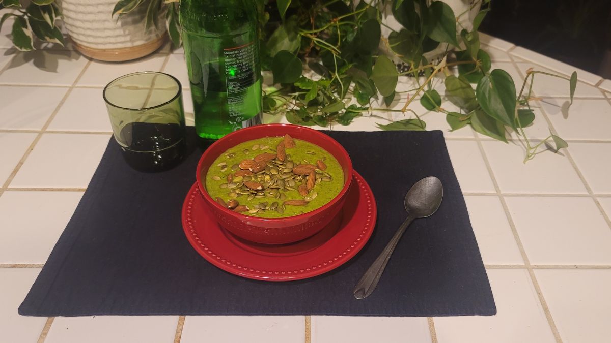raw microgreens bowl with arugula kale avocado pumpkin seeds and almonds