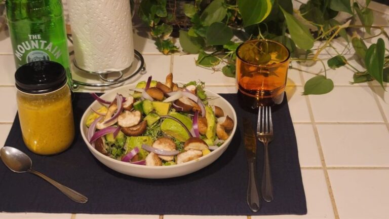 Raw plate with microgreens, shiitake mushrooms, avocado, and seeds