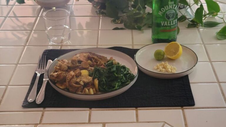 Plate of salmon, shredded chicken, lion&rsquo;s mane mushroom, and steamed greens with lemon, lime, and garlic on the side
